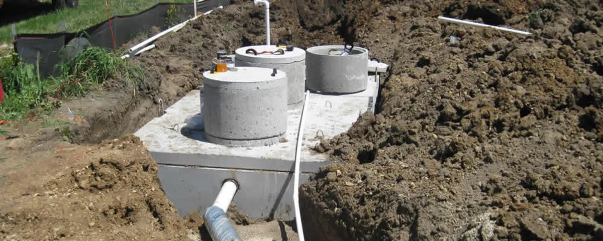 Septic system repair and installation site with tank access ports in New Orleans, LA