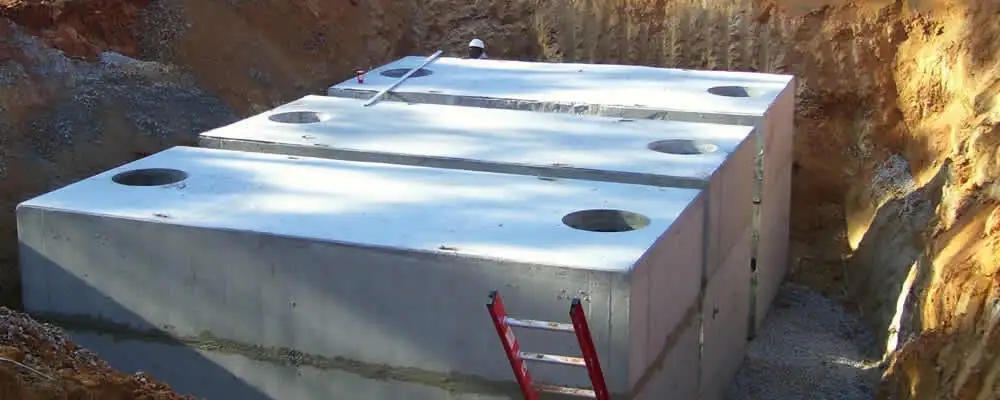 Septic tank installation site with a newly placed concrete tank in New Orleans, LA